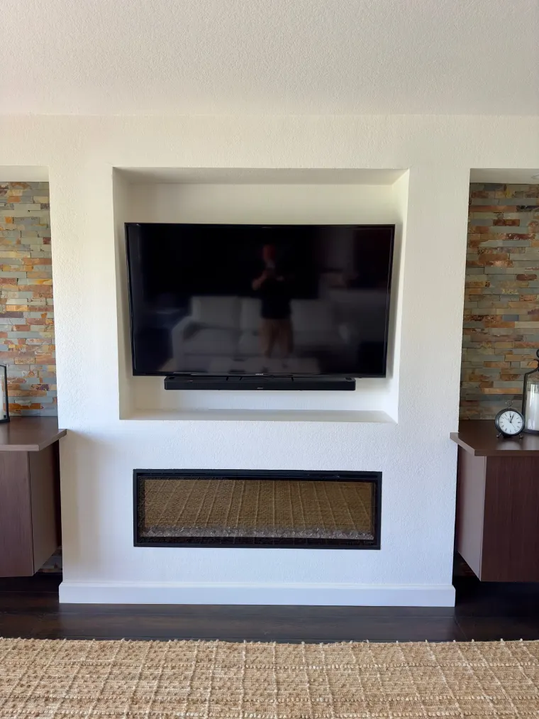Fireplace television and soundbar installation