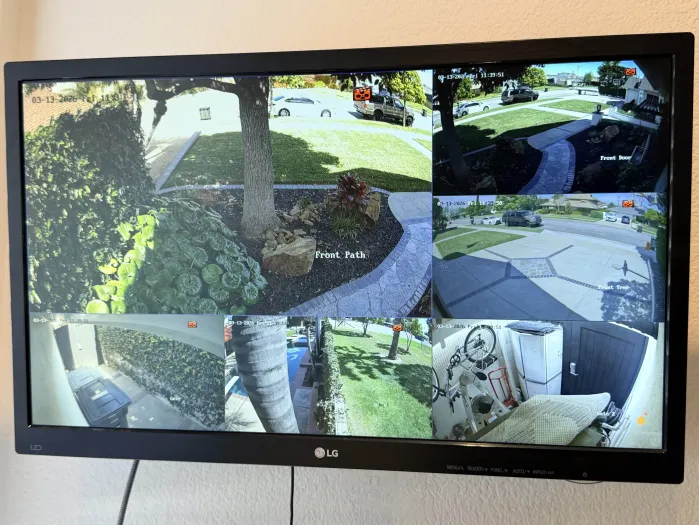 Live surveillance monitor displaying multiple camera feeds