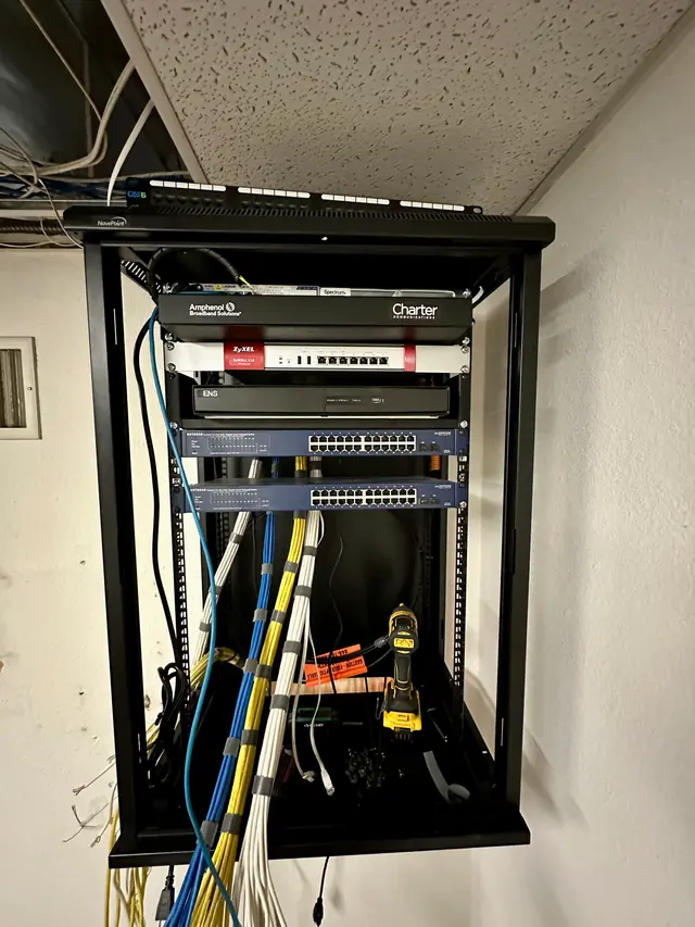 Wall rack with modem, firewall and switch for a small business network