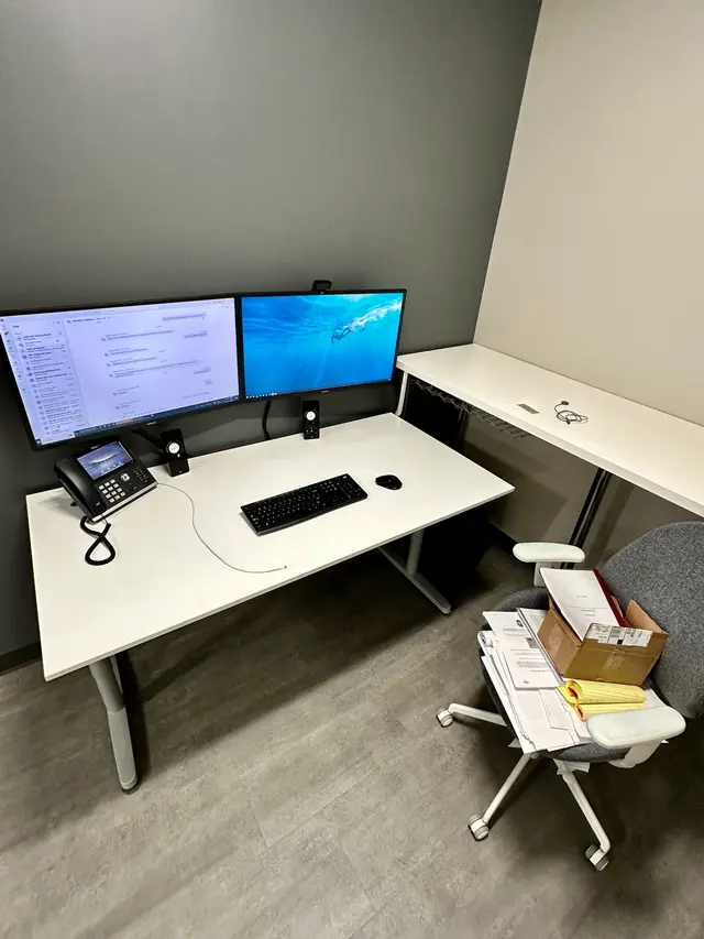 New business workstation with dual monitors and VoIP phone installed