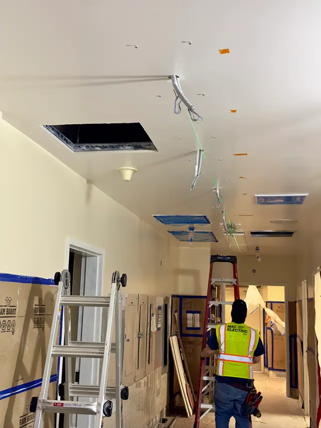 Hospital corridor during structured cabling rough-in