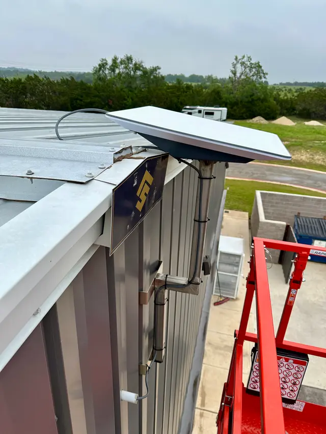 Starlink satellite internet dish installed on a commercial roof in Orange County