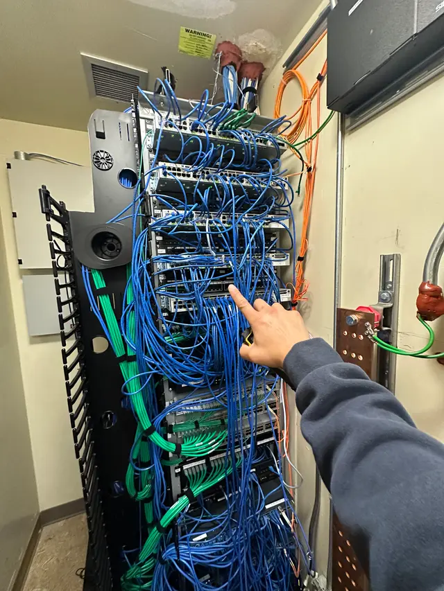 Tangled rack cabling before remediation and re-dressing