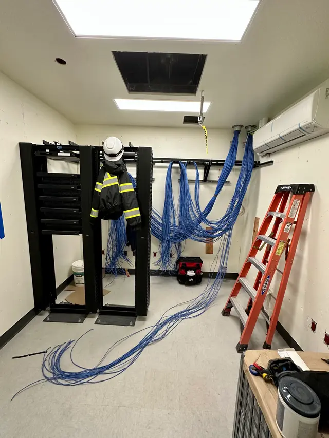 CoreConnectIT technician building out an IDF rack at a hospital