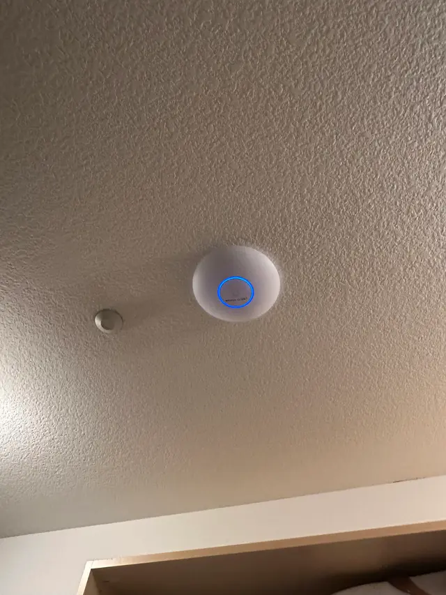 Wireless access point mounted on an office ceiling